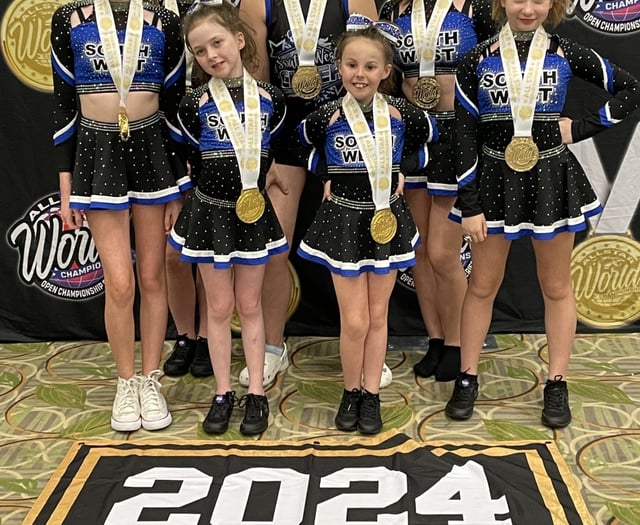Cheerleaders bring gold home to Okey