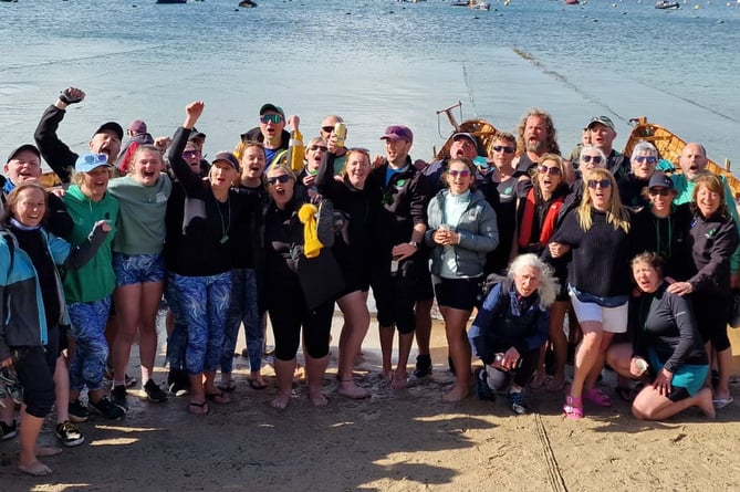 Cotehele Quay Gig Club celebrating their results at the World Gig Championships on the Isles of Scilly.