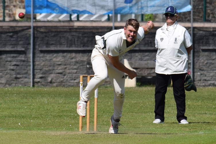 Hatherleigh paceman Charlie Neilson hurls down a delivery in his side's game at Bovey Tracey | Photo: Conrad Sutcliffe