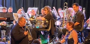 Tributes to brass band founder as he hangs up his baton after 20 years