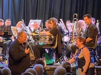 Tributes to brass band founder as he hangs up his baton after 20 years