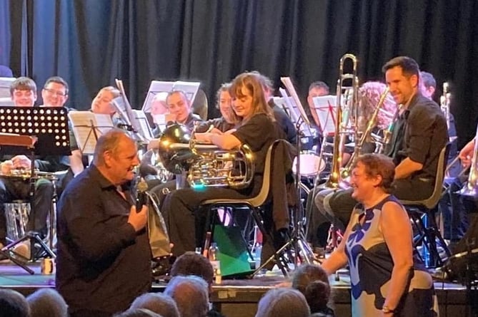 Peter and Sarah Jones are thanked at the Devon County Youth Brass Band 20th anniversary concert