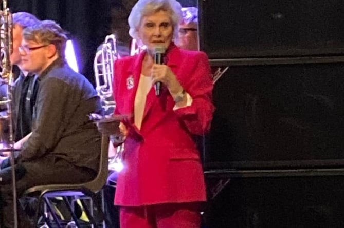 Band patron Angela Rippon speaks at the concert
