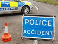 Car on its side after crash in Lamerton
