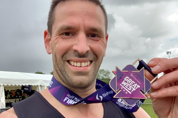 Ian Collacott with his medal after the Great West Run