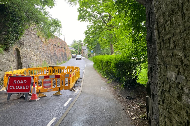 Pixon Lane is partly closed after a water pipe burst.