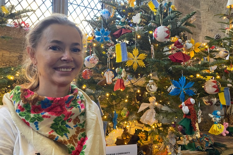 Tatiana Kovalchuk decorating the Ukrainian tree at Tavistock Christmas Tree Festival last year. One of the many community events she is involved with to integrate refugees.