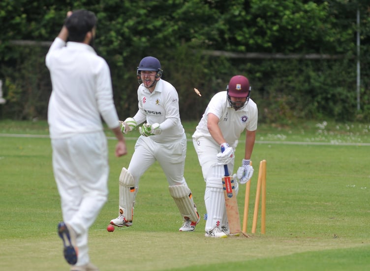 Devon Cricket League A Division. Abbotskerswell verus Torquay & Kingskerswell. A 98 run win for the visitors. Abbotskerswell 'keeper Ed Smout Cooper is delighted at Tim Western's wicket falls to Parminder Singh's bowling