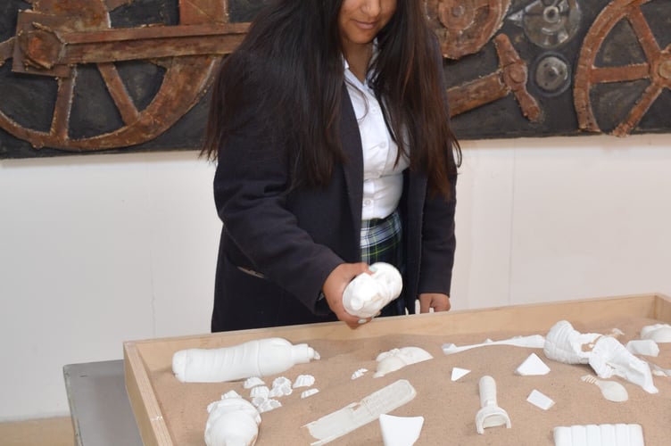 Dani, a Mount Kelly College A-level art student, with her waste study piece at the college public exhibition.