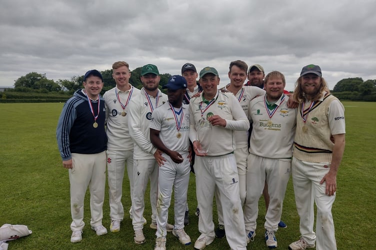 Belstone captain Richard Drake with the trophy and the rest of the team