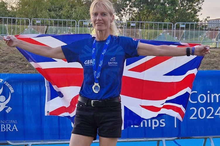 Jenny Jeeves, European celebrates her European triathlon silver in her age category.