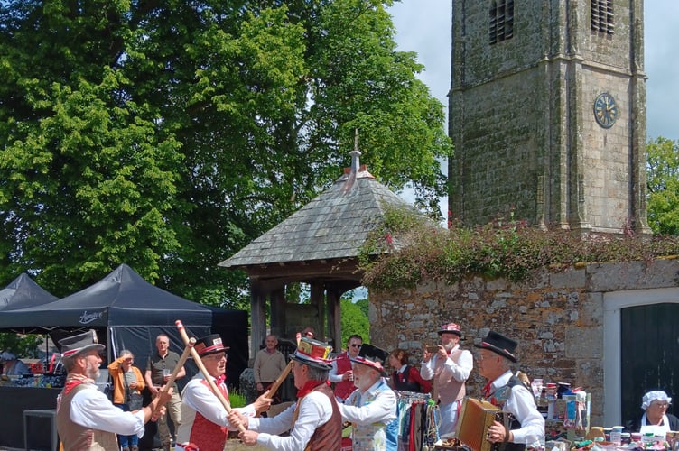 Tinners Morris dancing outside St Andrew's Church in Sampford Courtenay