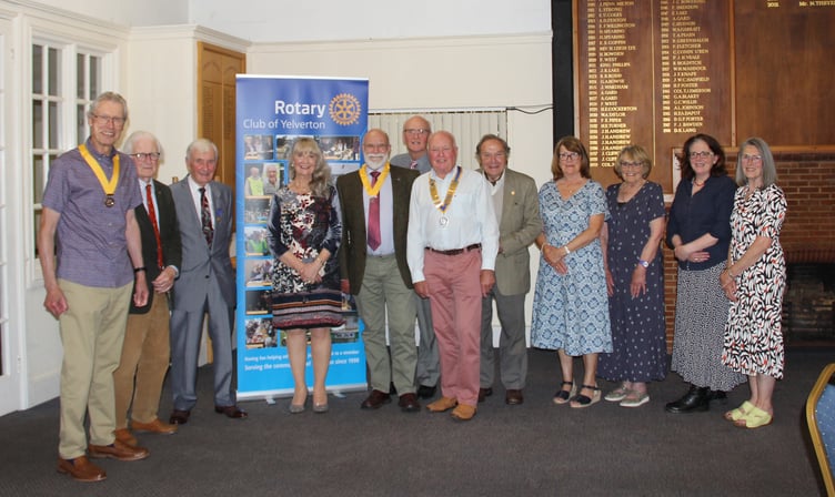 Centre of the front row wearing chain of office President Paul Williams on the extreme left of the picture is the incoming Vice President Roger Aggett together with other club members.