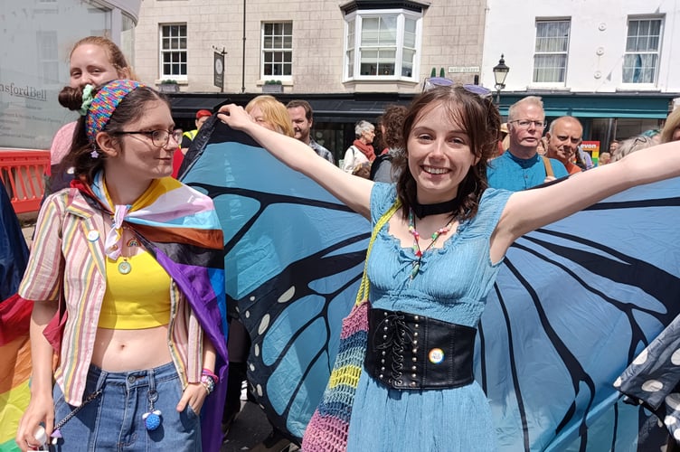 Tavi Pride winged girl and friend celebrate inclusivity.