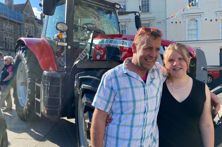 Jodie Medland and her farmer dad Tommy with his tractor in Bedford Square before he took her to her proms in it.
