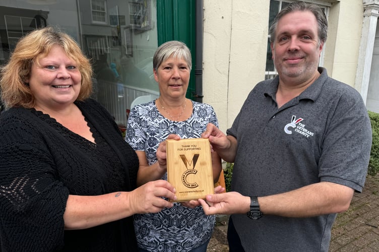 From left, Cllr Jennifer Paulfrey and Sally Lawrence receiving the thank you plaque from Danny Greeno, chief executive, The Veterans Charity. AQ 7836