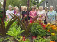 Scarecrows boost village floral contest