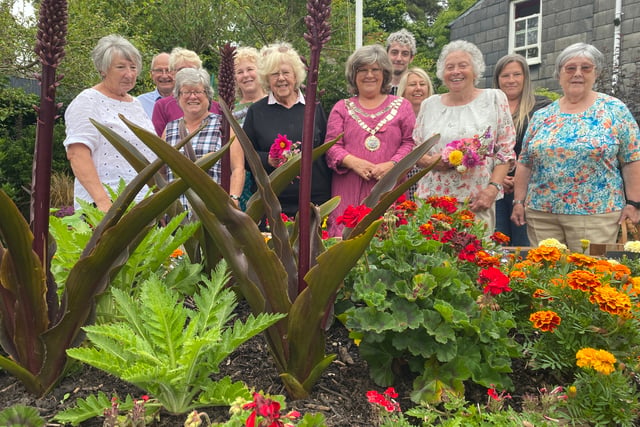 Scarecrows boost village floral contest