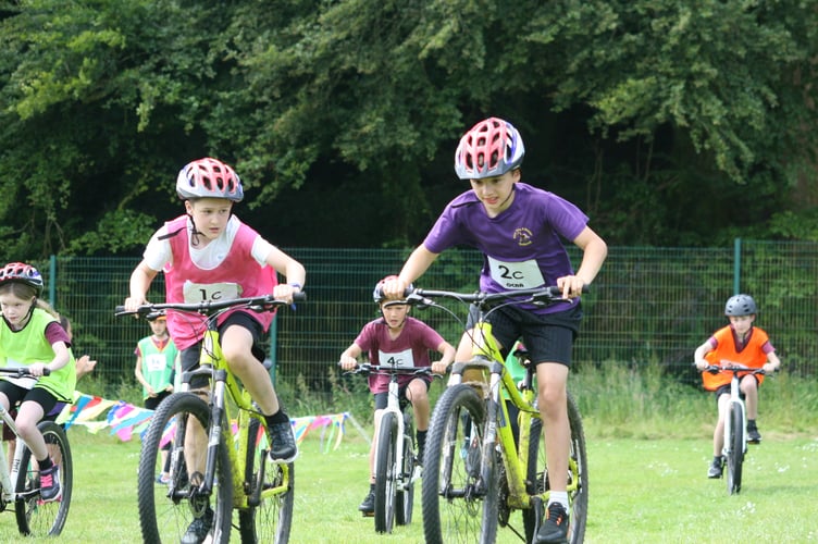 Mary Tavy & Brentor battling Tavistock School at the primary schools cyclo-cross.