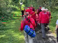 Rescue volunteers help fallen woman