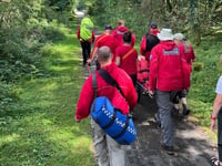 Rescue volunteers help fallen woman
