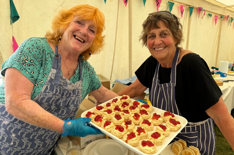 Serving cream teas in aid of Moretonhampstead Information Centre were a raft of volunteers.  AQ 0669