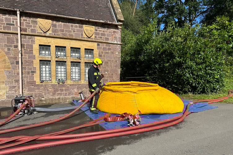 Firefighter at the scene at Knightshayes