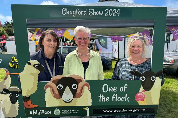 West Devon Borough Council stand was busy, manned by, from left, Dil Lord, Cllr Jan Elliott (Chagford ward) and Susannah Hunter.  AQ 0689