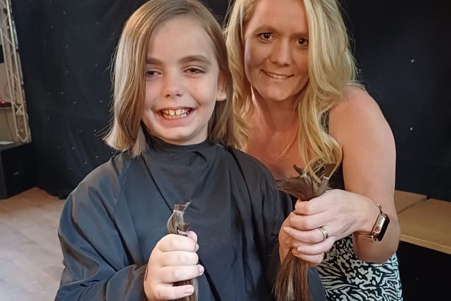Girl donates long locks in pub fundraiser