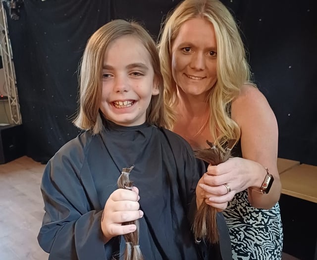 Girl donates long locks in pub fundraiser