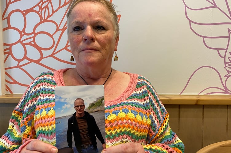 Lisa Pencarrow holding a picture of her son Ben who took his own life. Lisa is campaigning for improved mental health support.