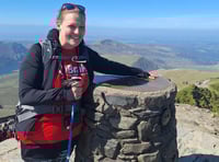 Teacher conquers mountain in friend's memory