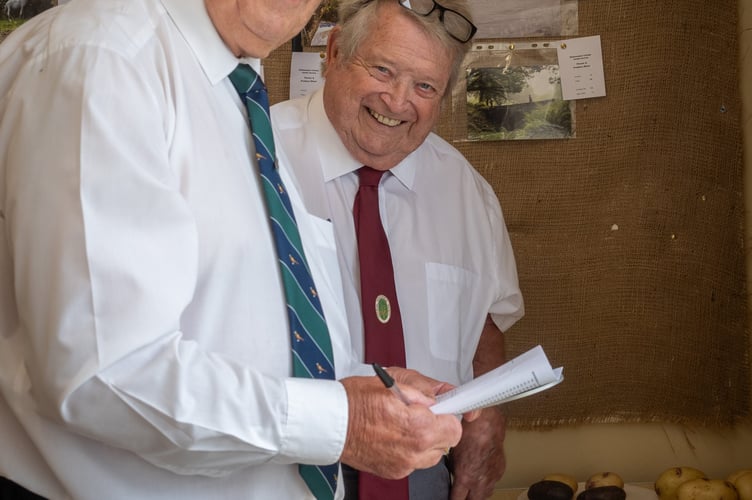Vegetable judges Rick Hoskin and Bill Radmore hard at work