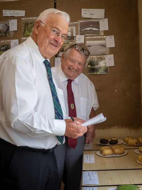 Vegetable judges Rick Hoskin and Bill Radmore hard at work