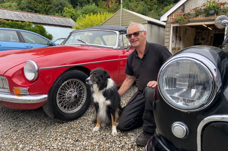 Brian Davis and classic cars with pet dog Cocoa.