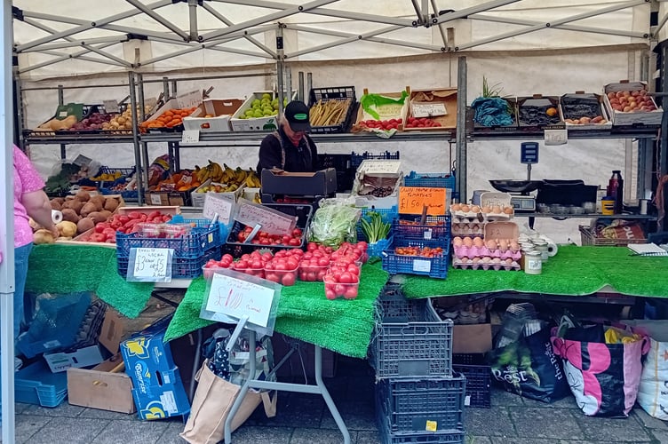 Buying local food is a pleasure, and comes without packaging.Here, a fruit and veg stall in Tavistock's Bedford Square