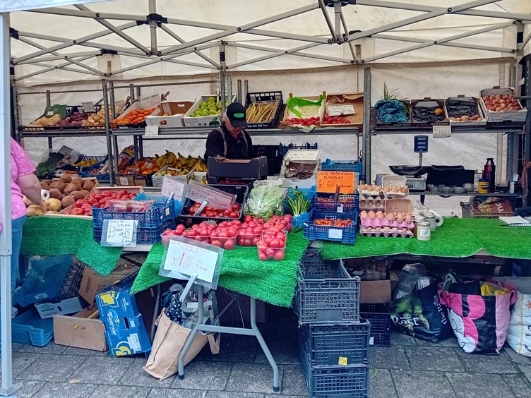 Buying local food is a pleasure, and comes without packaging.Here, a fruit and veg stall in Tavistock's Bedford Square