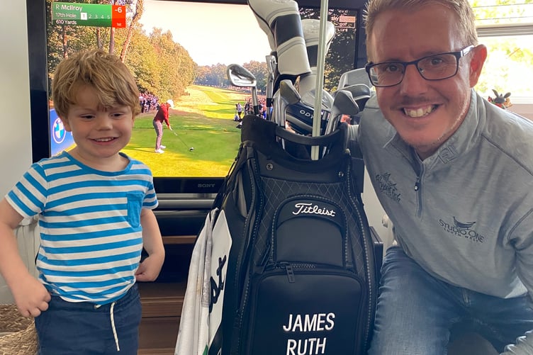Golf pro James Ruth at his Whitchurch home with son Jacob and PGA Cup bag and clubs