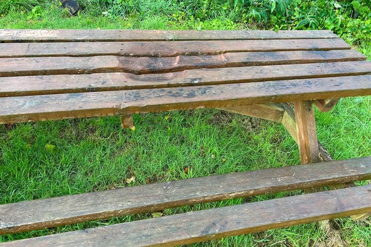 The picnic table in the garden has been left scorched and buckled