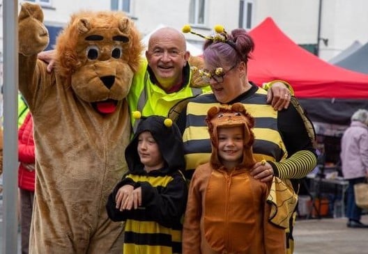 Lions president Andy Burnard with mascots Lenny the Lion and Bizzy the Bee and their miniature versions
