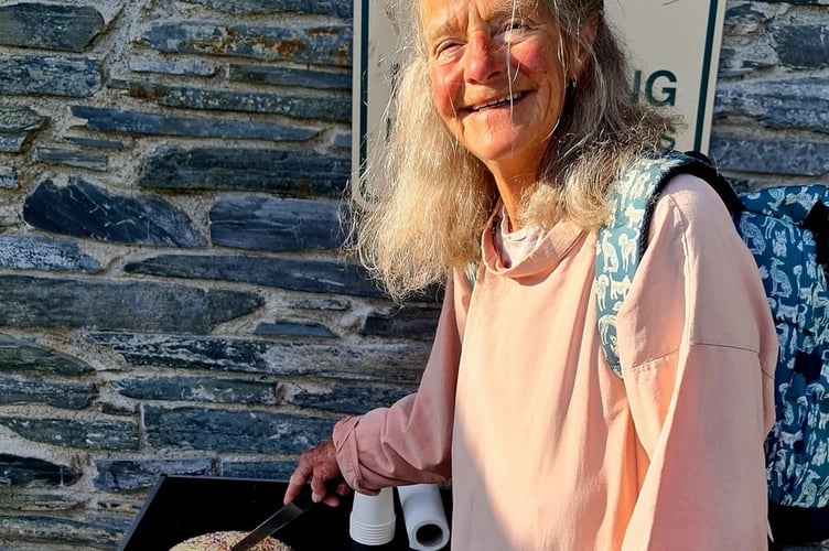 Tidy Tavi community litter picking group co-founder Jane Miller cuts the group's 13th birthday cake