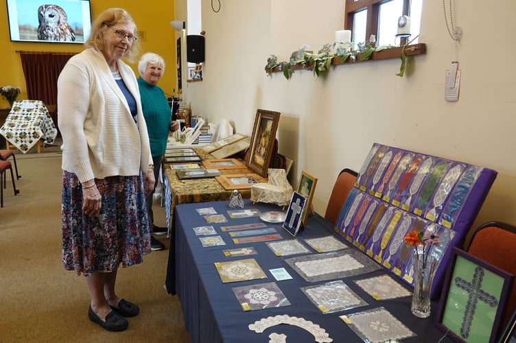 Joint organisers Rosie Bone and Glenys Whelan with the display of crafts at Bere Alston United Church. Glenys also made the lace items and baked the harvest loaf. Pictures by Ann Parsons