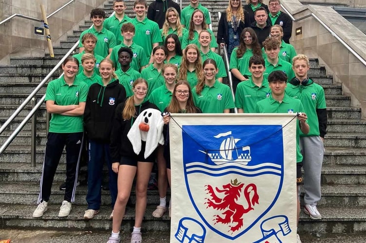 Tavistock Swimming Club 's Evie (second row from the front far left) with the Devon ASA at the national championships in Sheffield.