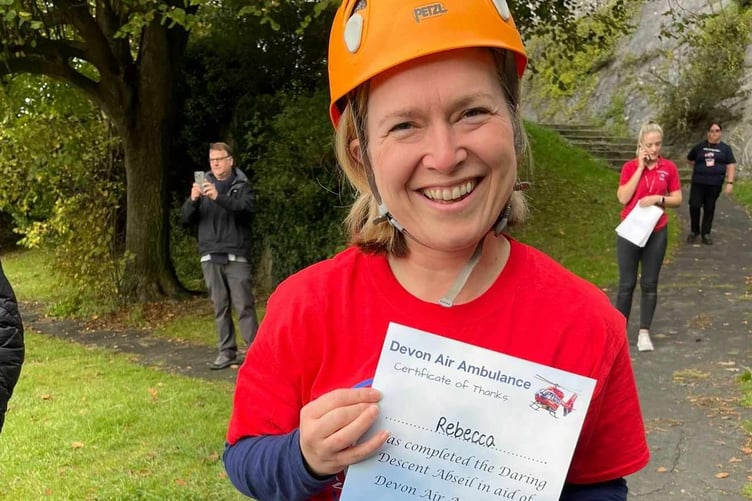 SW Devon MP Rebecca Smith bravely abseiled down Plymouth Cityadel in aid of Devon Air Ambulance after the charity helped an ex-colleague after an accident.