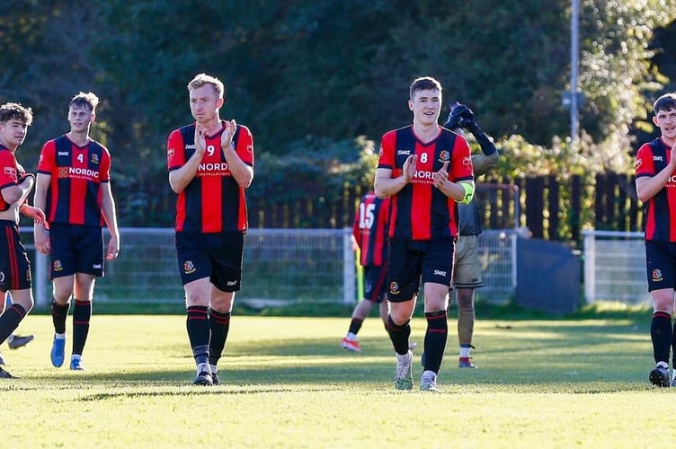 Tavistock AFC players applaud the fans after beating Thatcham Town