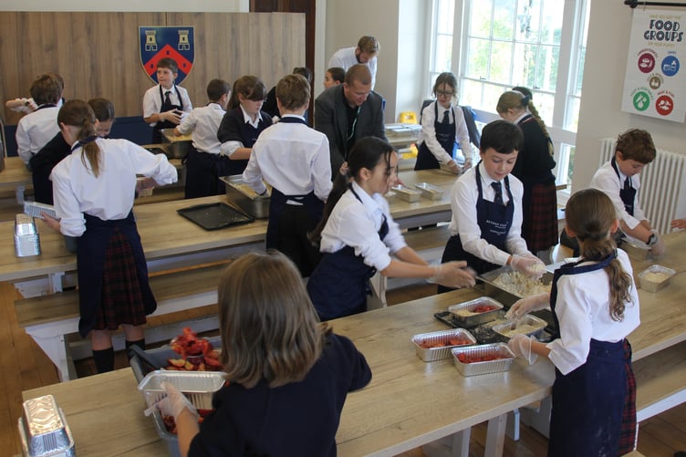 Kind-hearted young cooks from Mount Kelly College making apple crumbles for charity