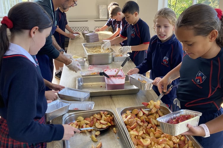 Mount Kelly College pupils mark harvest time by making apple crumble desserts for those in need.
