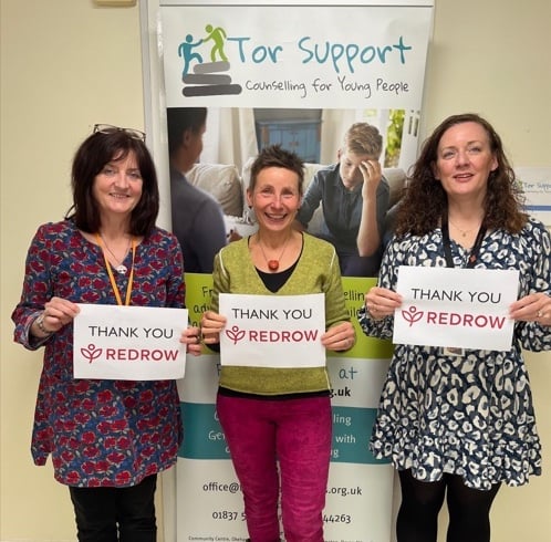 Okehampton's Tor Support Services express their thanks for Redrow's donation