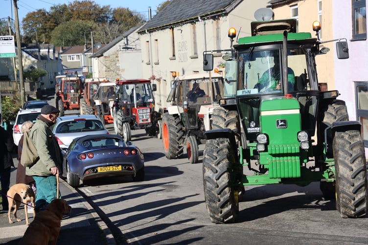 A roaring cavalcade of tractors draws attention navigating Horrabridge's narrow roads.