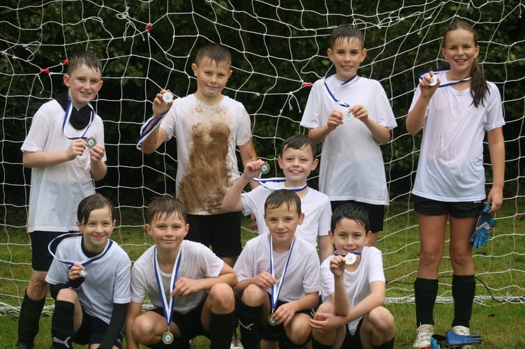 Smiles all round for the winners in white